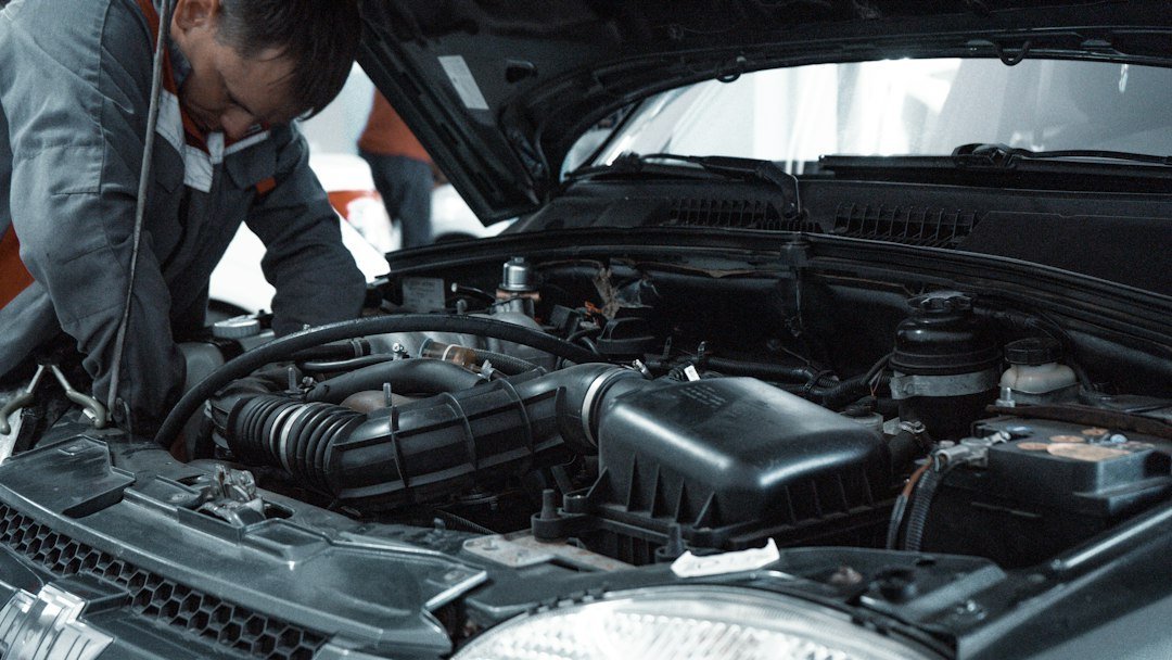 Mechanic inspecting a vehicle in a workshop